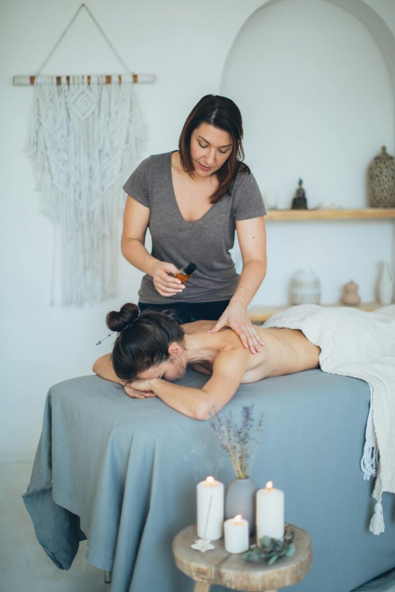 A Shirtless Woman Having a Massage